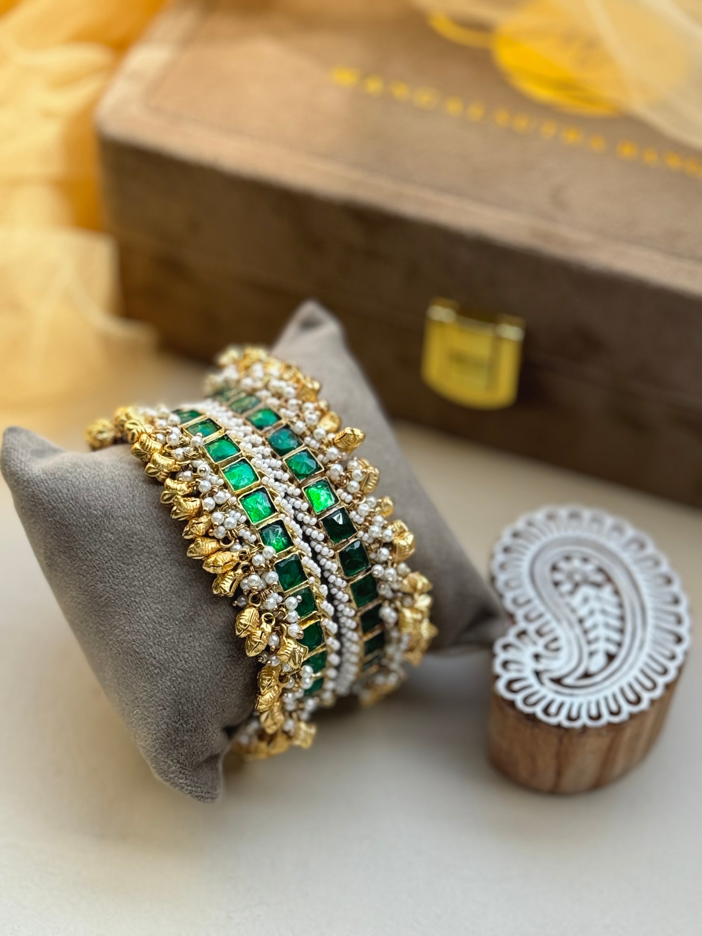 Square stone studded kangan with flower shape charm edges