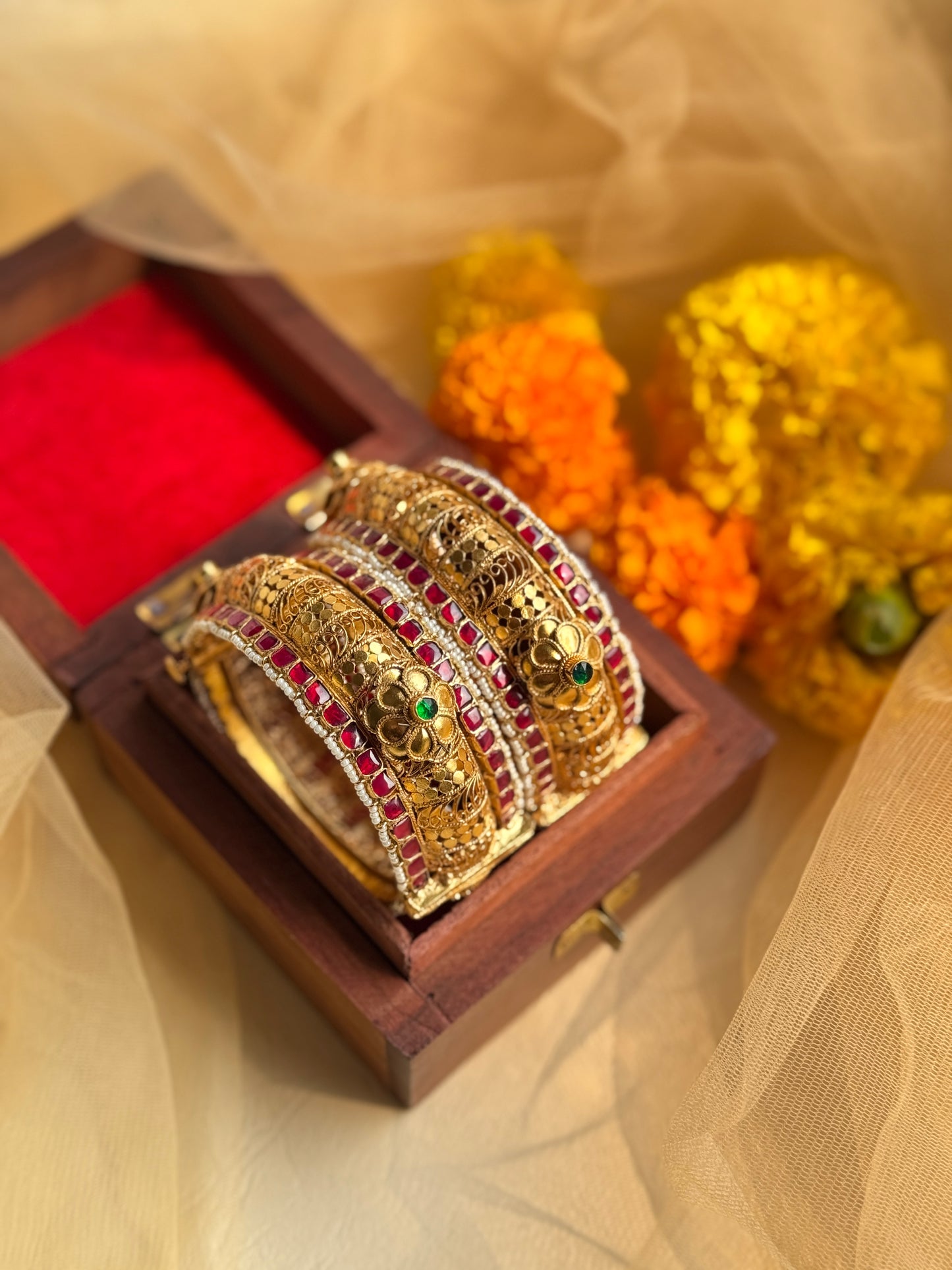Traditional gold plated kada with floral design