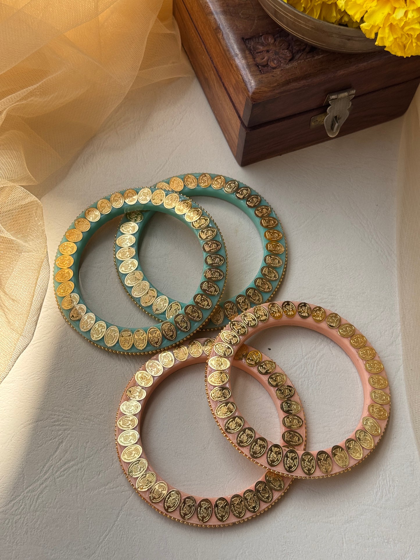 A Set of Bangles with Gold plating coin motif design